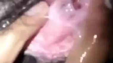 Young gal demonstrates the way she likes fingering her Desi XXX cunt