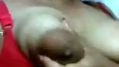 Desi love leans against the wall and takes her XXX boobs out of sex bra