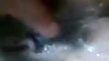 Aroused Indian shoves fingers into pussy and demonstrates her boobs