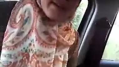 Arab hijab playing in car