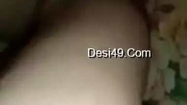 Wife lies on the bed letting the Desi hubby film the porn video