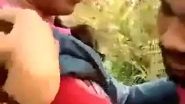 Indian outdoor sex of a guy sucking his GF’s tight boobs