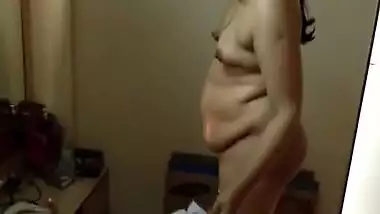Paunchy Desi woman with small tits shows her body in the porn video
