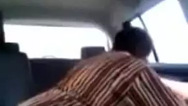 Tamil guy smooching and pressing boobs of cute girl in car